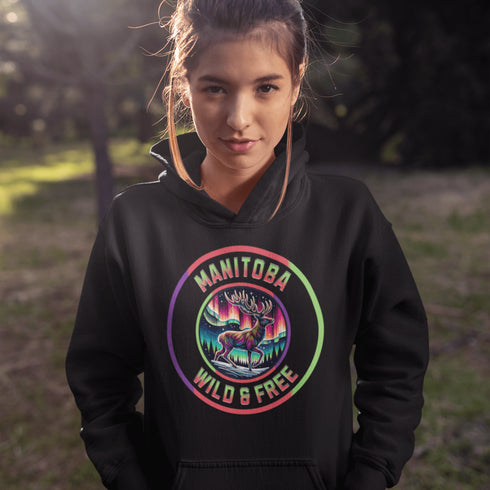Stay connected to the wild with our Manitoba – Wild & Free hoodie, featuring a majestic deer standing under the vibrant northern lights.